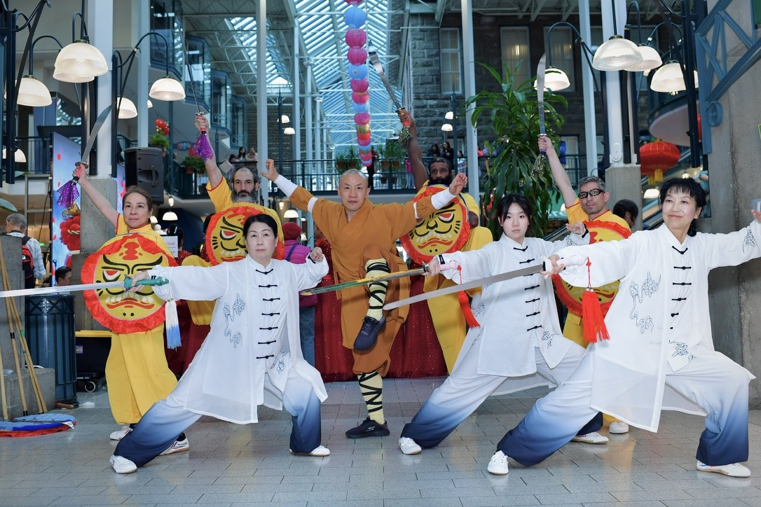 Tai Chi and sword practitioners in formation